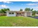 Charming single-story home with well-maintained lawn and attached garage at 7316 Tangelo Ave, Port Richey, FL 34668