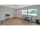 Bright living room with wood floors, natural light, and modern decor at 7316 Tangelo Ave, Port Richey, FL 34668