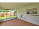 Enjoy outdoor living in this screened porch with a garden view at 7316 Tangelo Ave, Port Richey, FL 34668