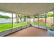 Spacious screened-in patio offering serene backyard views at 7316 Tangelo Ave, Port Richey, FL 34668