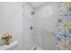 Shower stall featuring marble tile, modern shower head and hardware at 7316 Tangelo Ave, Port Richey, FL 34668