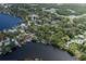 Aerial view of property highlighting waterfront location and lush, established landscaping at 7424 Grand Blvd, New Port Richey, FL 34652