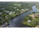 Aerial view showcasing waterfront property, private dock, and community surrounded by water at 7424 Grand Blvd, New Port Richey, FL 34652