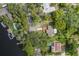 Bird's-eye view of a property outlined in yellow, featuring a private dock and waterfront access at 7424 Grand Blvd, New Port Richey, FL 34652
