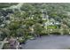 Aerial view of neighborhood showcasing mature trees and waterfront properties at 7424 Grand Blvd, New Port Richey, FL 34652