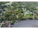Aerial view highlighting the property's location on the water, featuring a dock and neighborhood at 7424 Grand Blvd, New Port Richey, FL 34652
