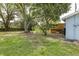 Spacious backyard with mature trees at 7424 Grand Blvd, New Port Richey, FL 34652