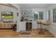 Stylish bar area features a wine fridge, glass shelving, custom copper still, and views to backyard at 7424 Grand Blvd, New Port Richey, FL 34652