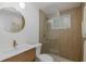 Updated bathroom featuring a modern vanity and a frameless glass shower at 7424 Grand Blvd, New Port Richey, FL 34652