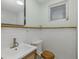Clean bathroom with white subway tile, modern vanity, and wood accents at 7424 Grand Blvd, New Port Richey, FL 34652