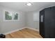 Neutral bedroom with hardwood floors, window shutters, and an indoor sauna at 7424 Grand Blvd, New Port Richey, FL 34652