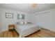 Serene bedroom with hardwood floors, plantation shutters, and ample closet space at 7424 Grand Blvd, New Port Richey, FL 34652