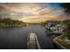 Beautiful water view featuring a private dock, waterfront access, and lush greenery at 7424 Grand Blvd, New Port Richey, FL 34652