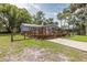 Cozy home featuring a spacious wooden deck, perfect for enjoying the outdoors at 7424 Grand Blvd, New Port Richey, FL 34652