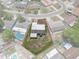Aerial view of property lines and home, nestled among the neighboring residences at 7608 Dale Dr, Port Richey, FL 34668