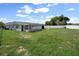Backyard with sun room attached at 7608 Dale Dr, Port Richey, FL 34668