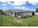 Backyard with sun room attached at 7608 Dale Dr, Port Richey, FL 34668