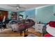 Bedroom features a queen sized bed frame, ceiling fan, hardwood flooring and a nightstand at 7608 Dale Dr, Port Richey, FL 34668