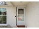 Front door has white trim and a 