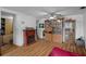Open living room with hardwood floors and a fireplace at 7608 Dale Dr, Port Richey, FL 34668