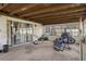 Enclosed sun room with multiple windows and outdoor access at 7608 Dale Dr, Port Richey, FL 34668