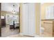 Hallway that connects the bedroom and bathroom, with plantation shutters on the windows at 7923 Woburn St, New Port Richey, FL 34653