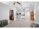 Open-concept kitchen with white cabinetry, pendant lighting, and breakfast bar seating at 7923 Woburn St, New Port Richey, FL 34653