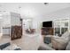 Open-concept living room with dining area, hardwood floors, and neutral paint at 7923 Woburn St, New Port Richey, FL 34653