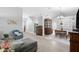 Open concept living and dining area with hardwood flooring, leading to kitchen at 7923 Woburn St, New Port Richey, FL 34653