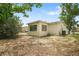 View of backyard featuring the rear of home and patio at 8053 Dedham Dr, Port Richey, FL 34668