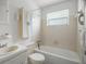 Clean bathroom featuring a combined tub and shower, vanity, and updated fixtures at 8053 Dedham Dr, Port Richey, FL 34668