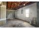 Spacious garage with exposed rafters and concrete flooring at 8053 Dedham Dr, Port Richey, FL 34668