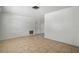Bright living room featuring tile flooring, neutral walls, and natural light from the window at 8053 Dedham Dr, Port Richey, FL 34668