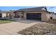 Street view of a single-story home with a two-car garage and well-maintained lawn at 8914 Schrader Blvd, Port Richey, FL 34668
