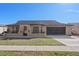 Charming single-story home showcasing a well-maintained lawn and attached two-car garage at 8914 Schrader Blvd, Port Richey, FL 34668