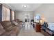Inviting living room featuring a comfortable couch and bright, airy space at 8914 Schrader Blvd, Port Richey, FL 34668