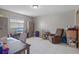 Well-lit living room offering comfortable seating, a TV, and natural light at 8914 Schrader Blvd, Port Richey, FL 34668