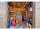 Organized shed featuring upper cabinets and ample storage space for tools and supplies at 8914 Schrader Blvd, Port Richey, FL 34668