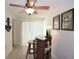 Home bar area with tile floors, and a ceiling fan above the bar at 9003 Lido Ln, Port Richey, FL 34668