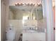 Bathroom featuring vanity, toilet, and shower with tile at 9003 Lido Ln, Port Richey, FL 34668