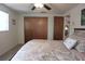 Bedroom featuring carpet floors, a ceiling fan, closet doors, and seaside decor at 9003 Lido Ln, Port Richey, FL 34668