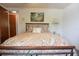Bedroom featuring seaside decor, a ceiling fan, and a wooden floor entryway at 9003 Lido Ln, Port Richey, FL 34668