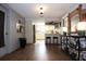Open kitchen area with wood floors, bar seating, and access to the outside at 9003 Lido Ln, Port Richey, FL 34668