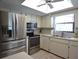 Modern kitchen with stainless steel appliances and ample counter space at 9003 Lido Ln, Port Richey, FL 34668