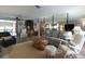 Spacious living room with open floor plan, neutral decor, and comfortable seating at 9003 Lido Ln, Port Richey, FL 34668