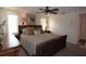Spacious bedroom featuring a king-size bed, ceiling fan, and ample natural light at 9003 Lido Ln, Port Richey, FL 34668