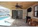 Lanai with Bamboo ceiling and poolside access at 9003 Lido Ln, Port Richey, FL 34668
