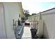 View of the side yard with fence and gate, offering privacy and functionality at 9003 Lido Ln, Port Richey, FL 34668