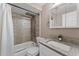 Bathroom with vanity, toilet and shower tub combination creates a clean and functional space at 9016 Unicorn Ave, Port Richey, FL 34668