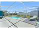 Relaxing screened-in pool area with comfortable seating, inviting you to unwind and enjoy the outdoors at 9016 Unicorn Ave, Port Richey, FL 34668